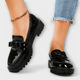 Mocassins féminins noirs en vernis avec nœud